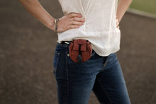 Load image into Gallery viewer, Satchel in Earth color on woman&#39;s hip on belt loop. White shirt and jeans. 